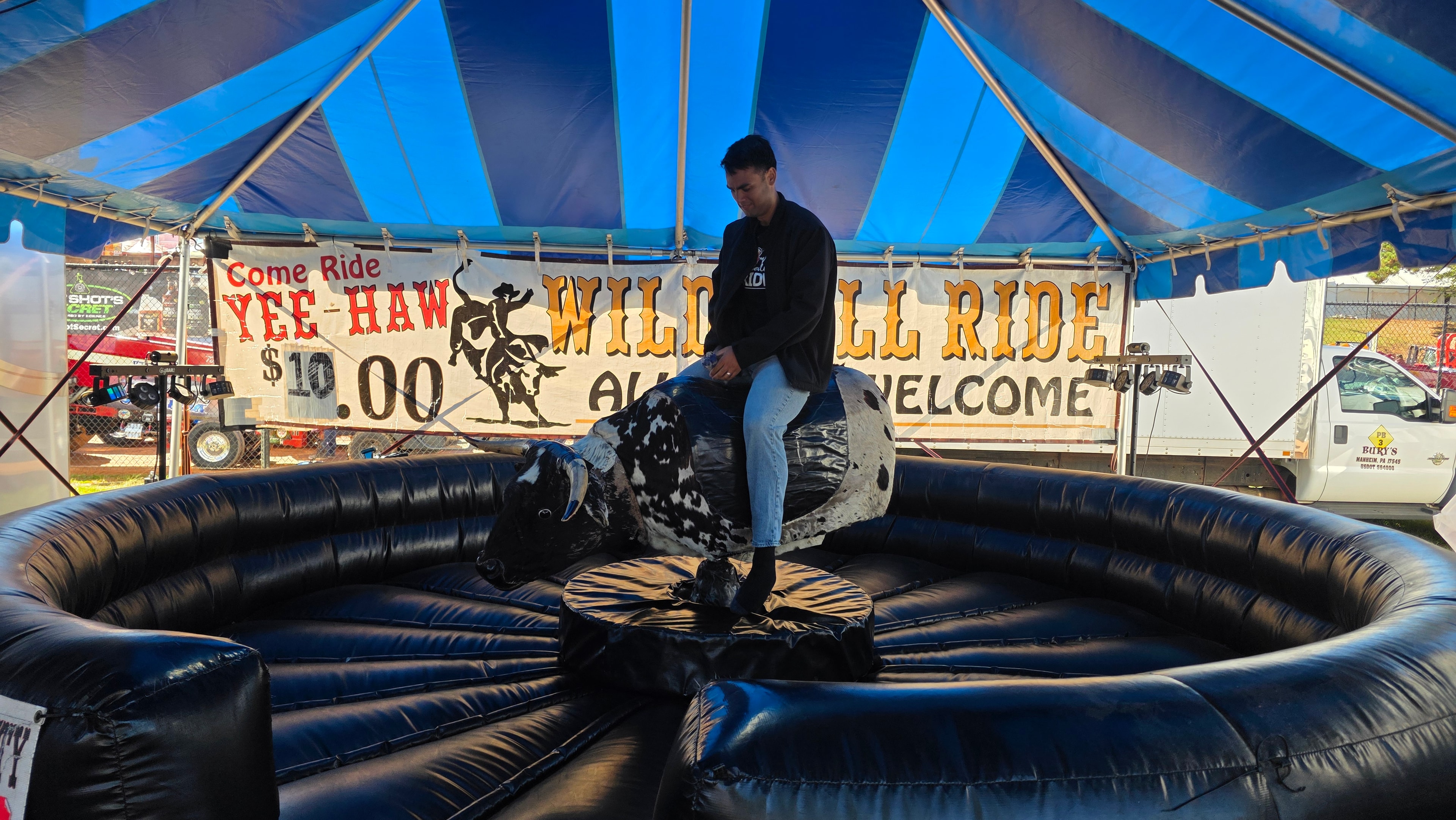 NC State Fair 2026 — mechanical bull ride under blue tent